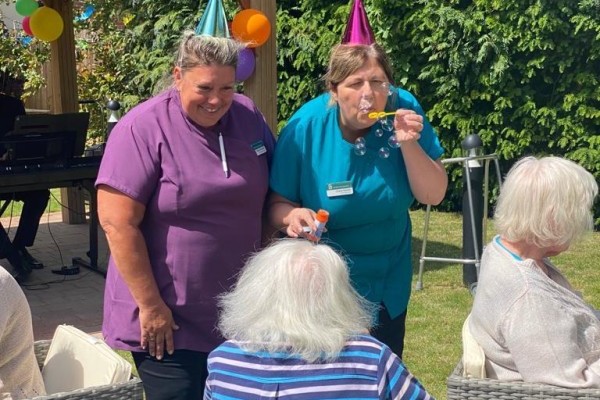 Carers celebrating with residents